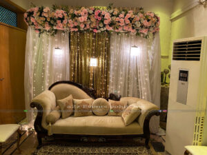floral backdrop, hanging chandeliers