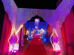 themed setup, entrance decor, wedding management, grand mehndi entrance