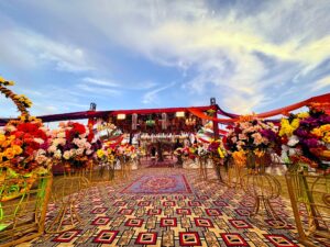 grand wedding setup, colorful mehndi decor, day time wedding, food suppliers