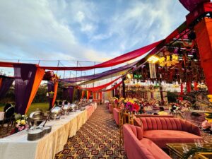 daytime-outdoor-wedding-event catering setup, seating arrangements, open air mehndi decor, grand wedding