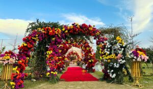 floral-wedding-entrance wedding decor, open air setup, multicolored mehndi, events planners