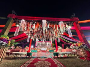 open-air-mehndi dance floor setup, hanging garden, colorful draping, wedding decorators