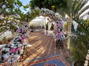 western-theme-event floral decor, entrance arches, open air event, wedding management