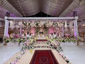 grand-wedding-stage indoor setup, floral work, event decor, western styling