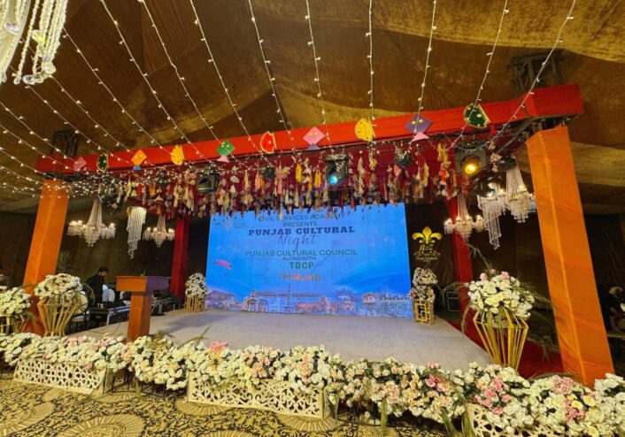 corporate stage, floral decor, chandeliers, hanging