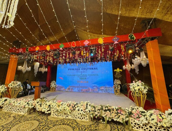 corporate stage, floral decor, chandeliers, hanging
