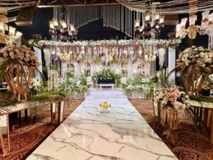 marble walkway, indoor setup, hanging chandeliers, wedding designers