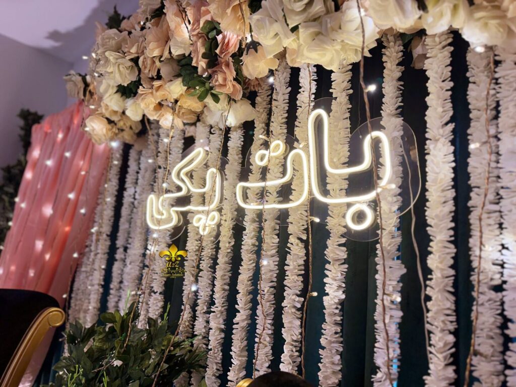 wedding-designers neon sign, floral backdrop, stage decor, events management