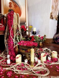bridal-campaign-decor crystal beaded decor, candles, fresh flowers, indoor bridal makeup campaign shoot set